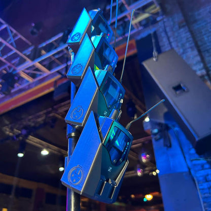 packHolder(4) in use at a live show with Sennheiser wireless bodypacks